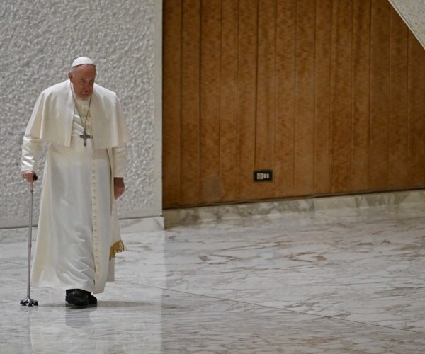 Pope Francis using cane walking in Rome