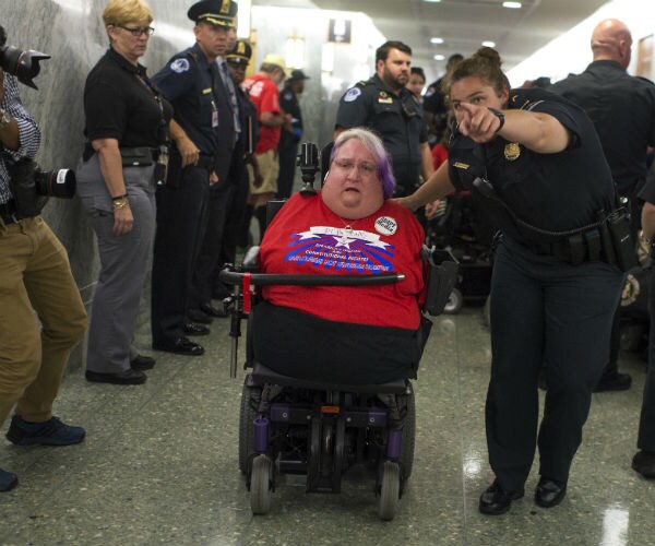 Protesters in Wheelchairs Disrupt Healthcare Bill Hearing