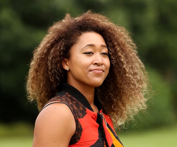 naomi osaka stands in field