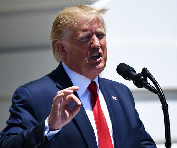 President Donald Trump speaking outside the White House