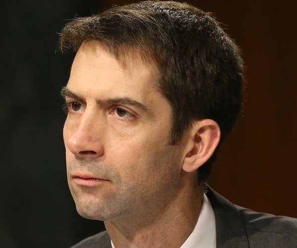 tom cotton listens at a hearing