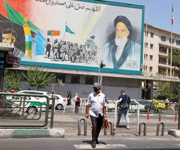 a billboard bears the portrait of the late supreme leader ayatollah ruhollah khomeini in tehran