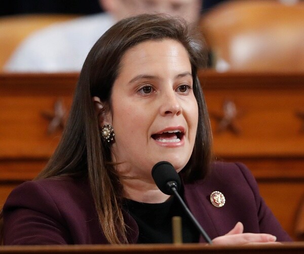 elise stefanik speaks into microphone