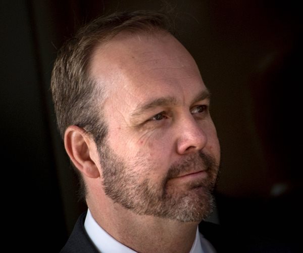 bearded rick gates faces left 