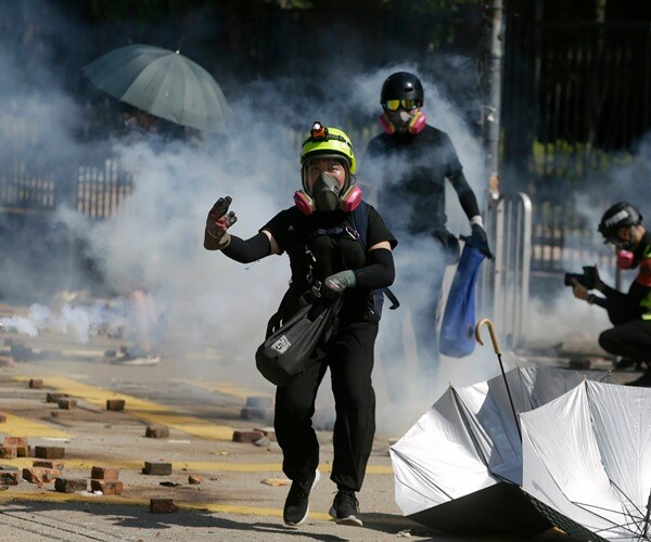 Hong Kong Police Threaten to Use Live Bullets as Standoff With Protesters Escalates