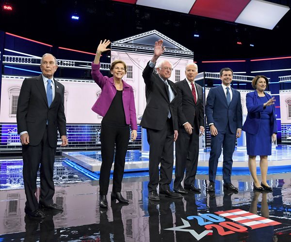 six democrats in a line onstage before the feburary 19 primary debate in las vegas