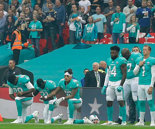 Police Cut Security at Dolphins Game to Protest Kneeling During Anthem