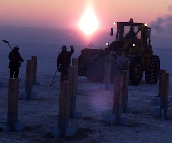 a tractor is shown with alaskans in the frozen earth of the great north