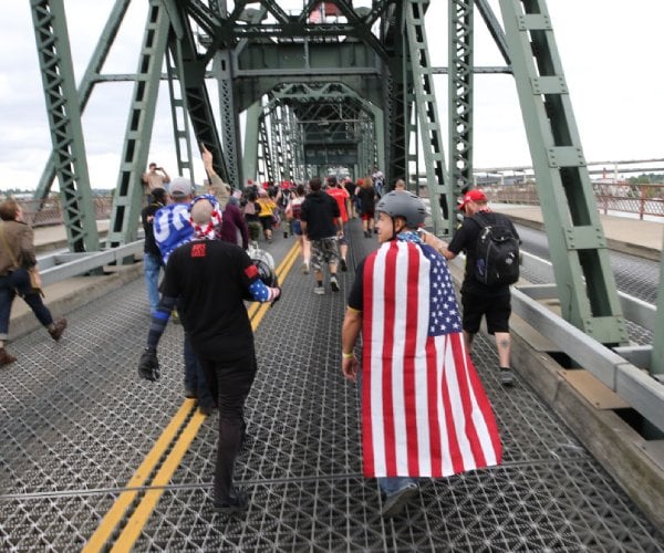 alt right groups cross a bridge during an end domestic terrorism rally in 2019 in portland oregon