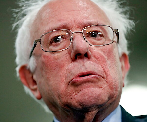 bernie sanders shows emotion during a democratic presidential primary debate