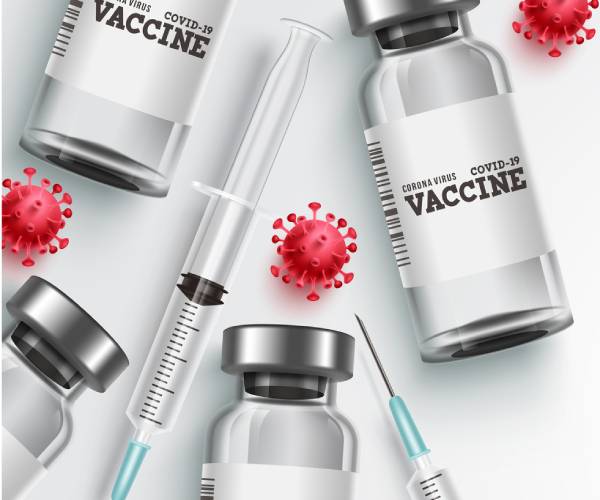 vaccine vials with syringes and covid representations