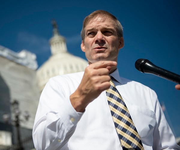 jim jordan stands in front of the capitol and speaks.