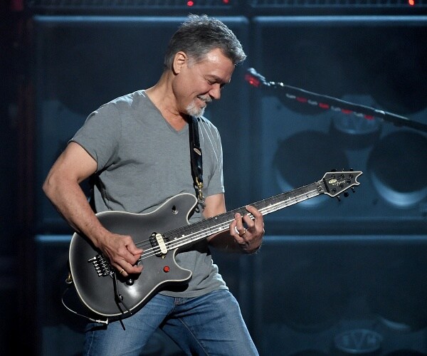 eddie van halen plays guitar