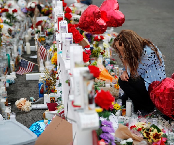 A woman mourns near the site of a shooting in El Paso, Texas