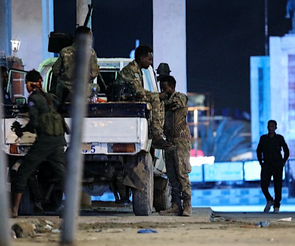 Security forces patrol near the Hayat Hotel 