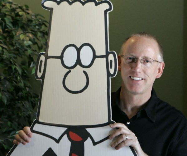 dilbert cartoon creator scott adams is shown holding a cardboard cutout of dilbert