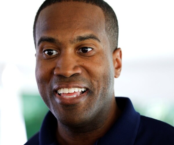 james in a polo shirt at a campaign event