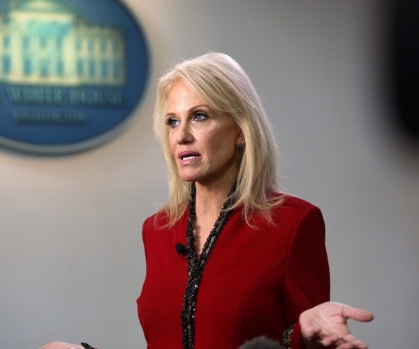 conway in a red dress with black lining