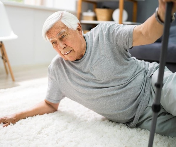 older man on floor after a fall