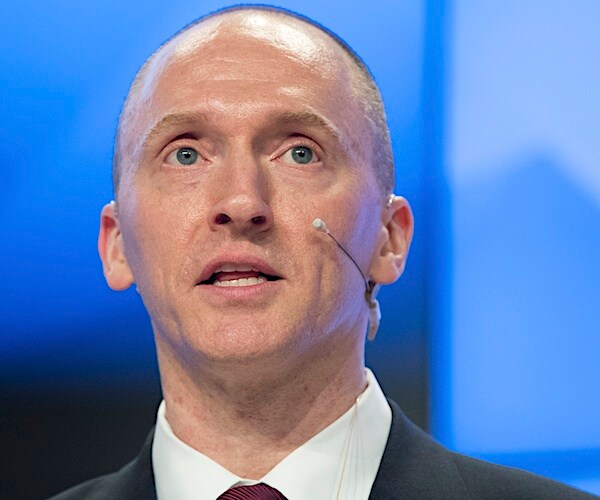 carter page wears an ear piece while speaking during a convention