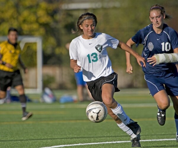 high school girls playing in soccer game