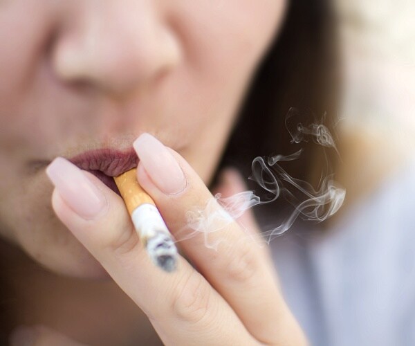 close up of woman smoking