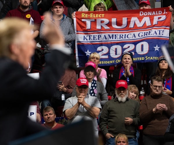 trump supporters listening to the president