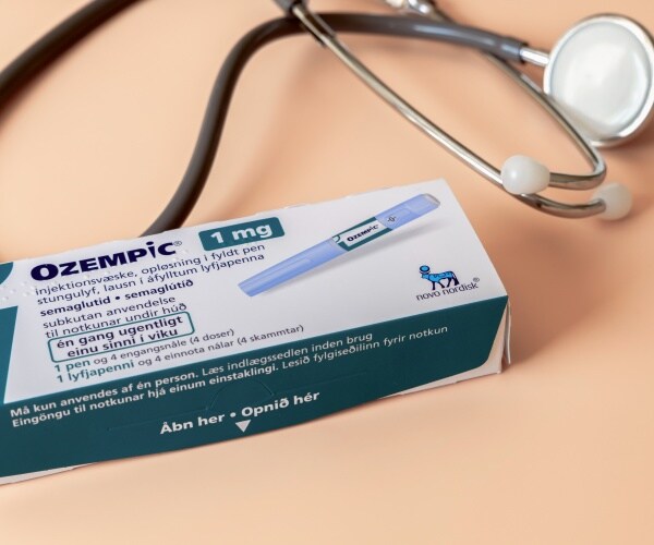 box of Ozempic and a stethoscope