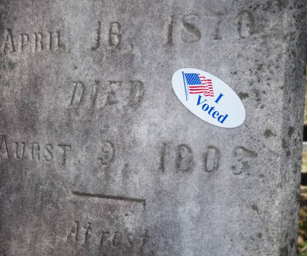 an i voted sticker on a tombstone