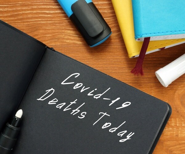 clipboard with heading "COVID-19 Deaths Today"