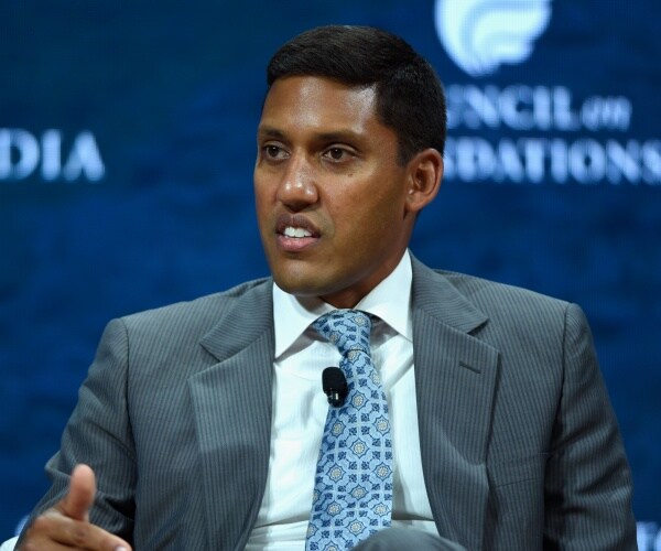 rajiv shah sits onstage