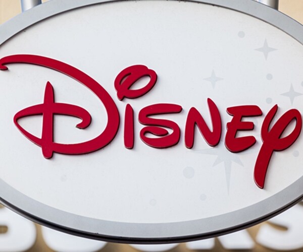 disney corporate store logo in red on white store front sign. 

