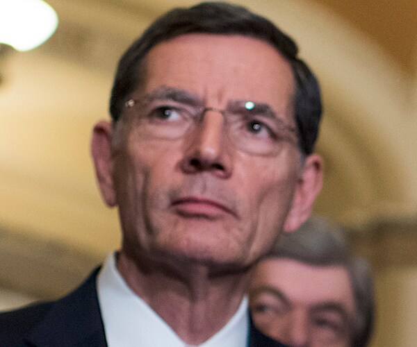 johbn barrasso looks his right and pauses during a senate news conference