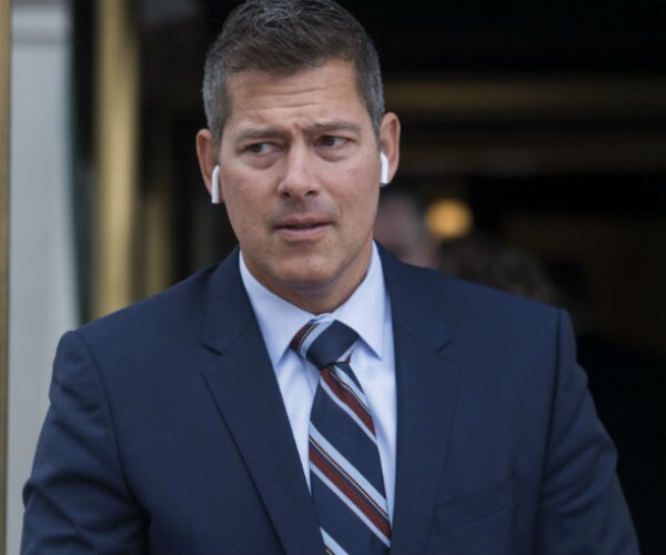 a man leaves a meeting of the gop conference at the capitol hill club