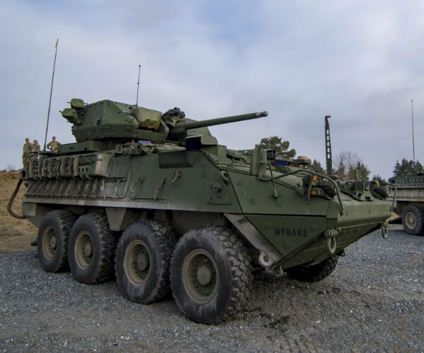 a green us military tank is shown