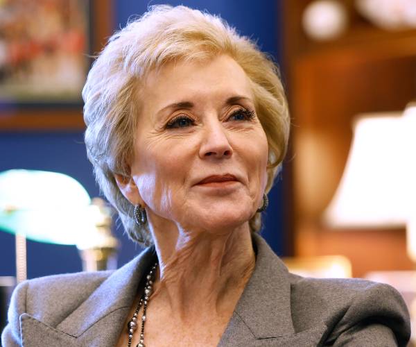 linda mcmahon sitting in an office