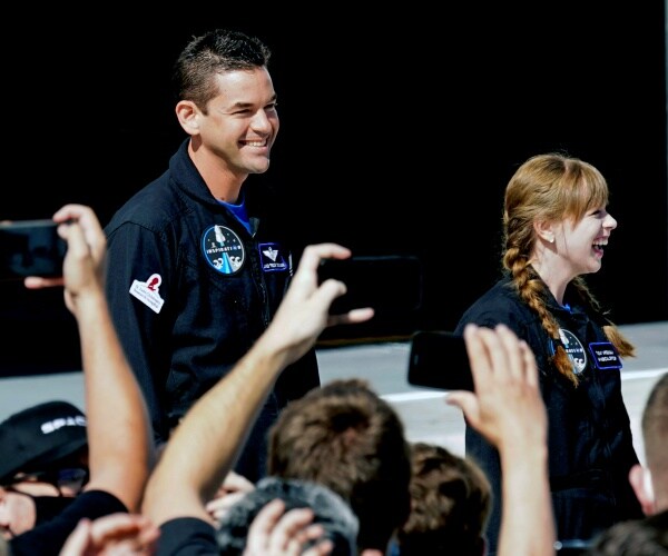 Jared Isaacman, left, and Hayley Arceneaux prepare to launch on a SpaceX Falcon 9 at the Kennedy Space Center