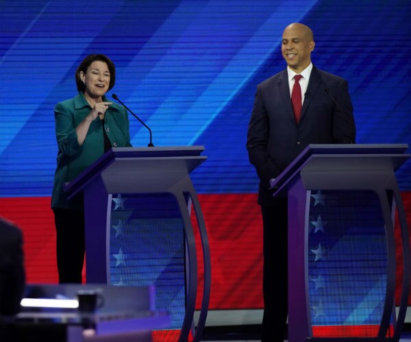 sen. amy klobuchar gestures with her hand while speaking