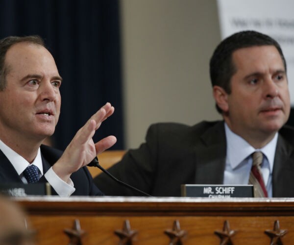 house intelligence committee chairman adam schiff and rep. devin nunes are shown in hearing on capitol hill