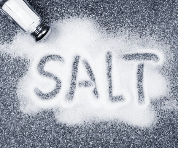 salt spilled from salt shaker spelling 'salt'