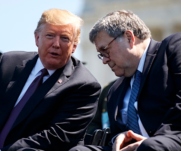 president donald trump and attorney general william barr lean into each other to talk