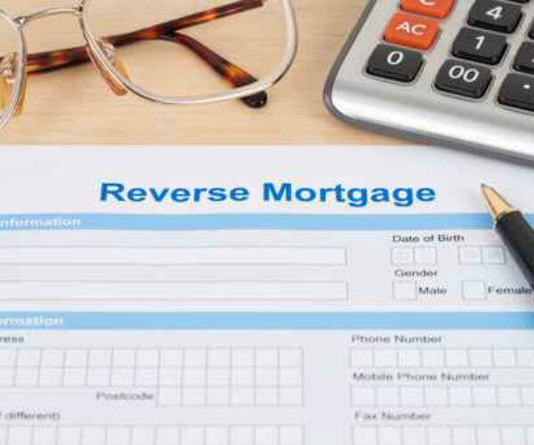 a graphic showing a reverse mortgage application, a calculator and a pair of glasses 