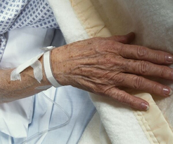 hand of patient with dementia in hospital