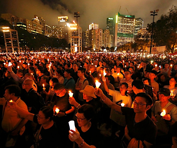 thousands attend a candlelight vigil for victims of the chinese government's brutal tiananmen square crackdown