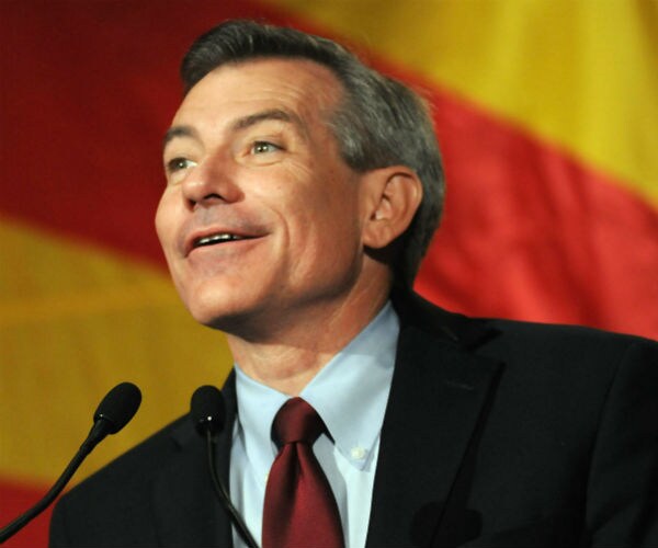 rep. david schweikert is seen in a dress suit, shirt and tie