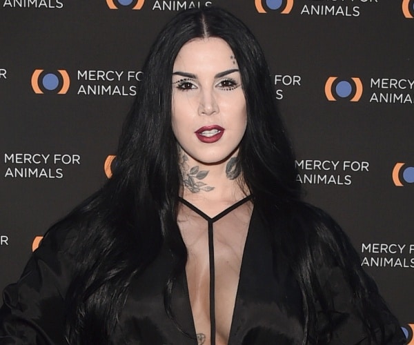 kat von d stands on red carpet