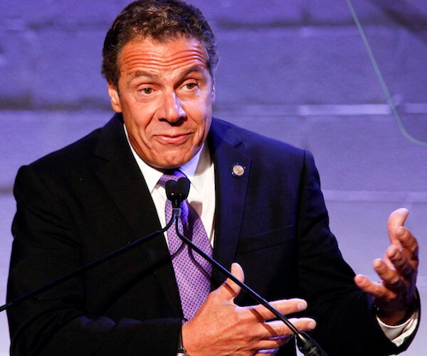 Gov. Andrew Cuomo gestures as he speaks to the media