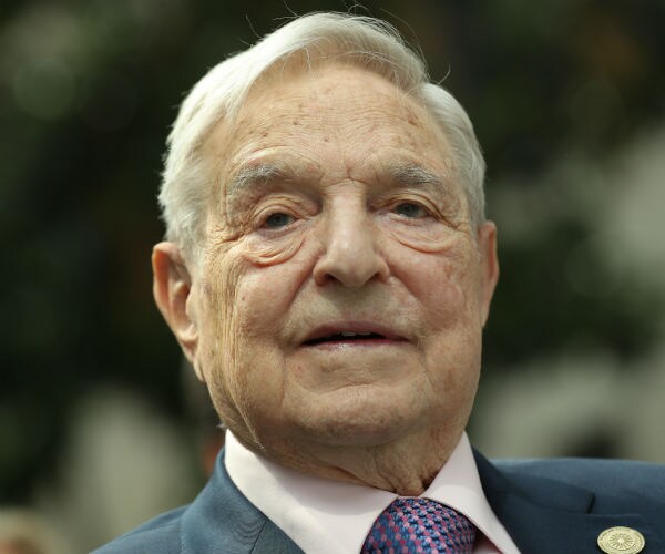 soros smiling and looking toward the camera