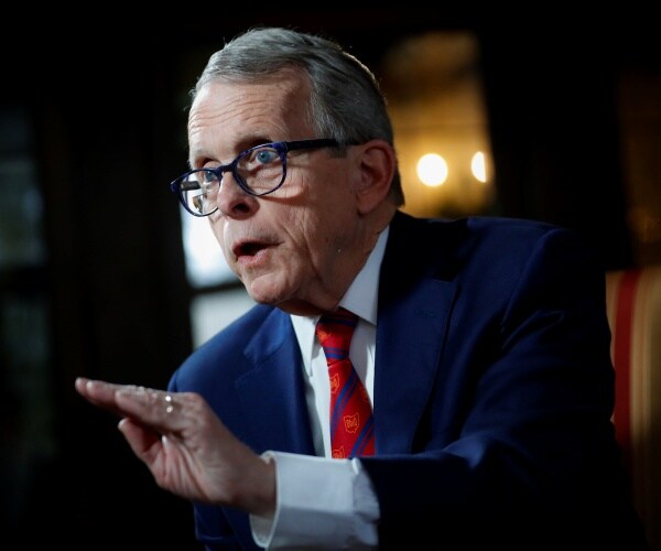 mike dewine speaks with his hand up