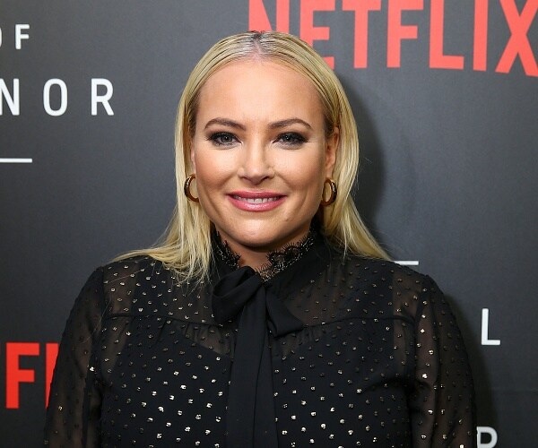 meghan mccain stands on red carpet